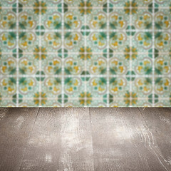 Image showing Wood table top and blur vintage ceramic tile pattern wall