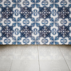 Image showing Wood table top and blur vintage ceramic tile pattern wall