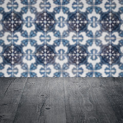 Image showing Wood table top and blur vintage ceramic tile pattern wall