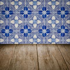 Image showing Wood table top and blur vintage ceramic tile pattern wall