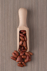 Image showing Wooden scoop with red beans