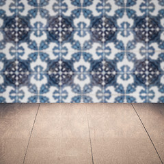 Image showing Wood table top and blur vintage ceramic tile pattern wall