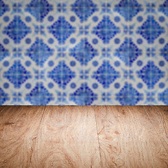 Image showing Wood table top and blur vintage ceramic tile pattern wall