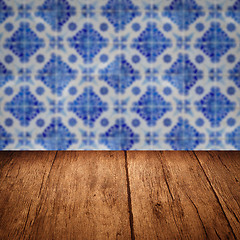 Image showing Wood table top and blur vintage ceramic tile pattern wall