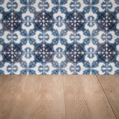 Image showing Wood table top and blur vintage ceramic tile pattern wall