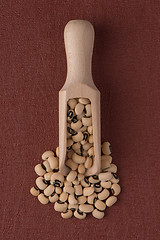 Image showing Wooden scoop with white beans