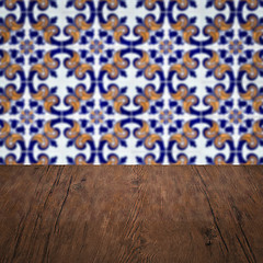 Image showing Wood table top and blur vintage ceramic tile pattern wall