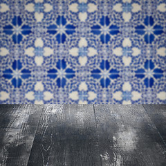 Image showing Wood table top and blur vintage ceramic tile pattern wall