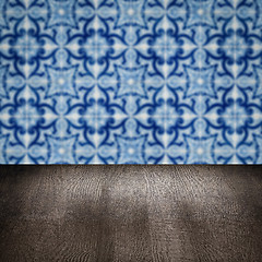 Image showing Wood table top and blur vintage ceramic tile pattern wall