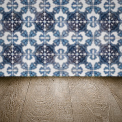 Image showing Wood table top and blur vintage ceramic tile pattern wall