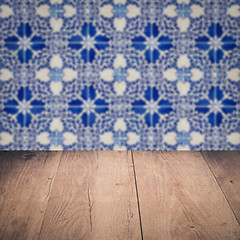 Image showing Wood table top and blur vintage ceramic tile pattern wall