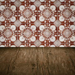 Image showing Wood table top and blur vintage ceramic tile pattern wall