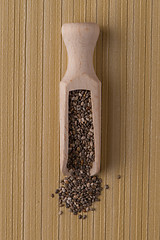 Image showing Wooden scoop with chia seeds