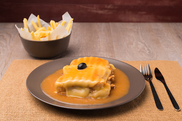 Image showing Francesinha and french fries