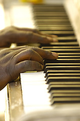 Image showing Hands and old piano