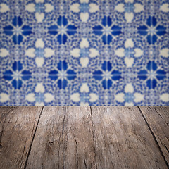 Image showing Wood table top and blur vintage ceramic tile pattern wall