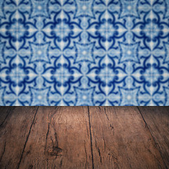 Image showing Wood table top and blur vintage ceramic tile pattern wall