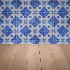 Image showing Wood table top and blur vintage ceramic tile pattern wall