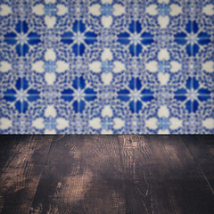 Image showing Wood table top and blur vintage ceramic tile pattern wall