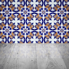 Image showing Wood table top and blur vintage ceramic tile pattern wall