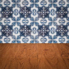 Image showing Wood table top and blur vintage ceramic tile pattern wall