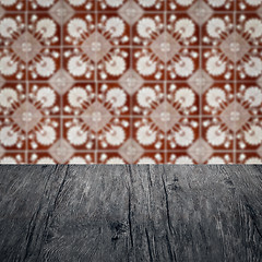 Image showing Wood table top and blur vintage ceramic tile pattern wall