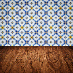 Image showing Wood table top and blur vintage ceramic tile pattern wall