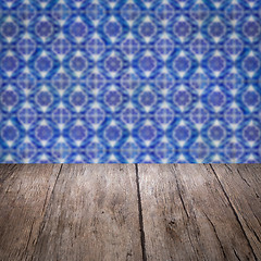 Image showing Wood table top and blur vintage ceramic tile pattern wall