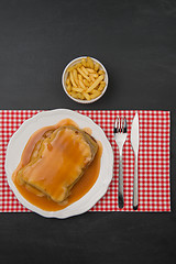 Image showing Francesinha and french fries