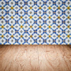 Image showing Wood table top and blur vintage ceramic tile pattern wall