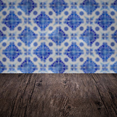 Image showing Wood table top and blur vintage ceramic tile pattern wall