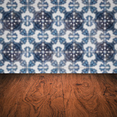 Image showing Wood table top and blur vintage ceramic tile pattern wall