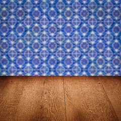 Image showing Wood table top and blur vintage ceramic tile pattern wall