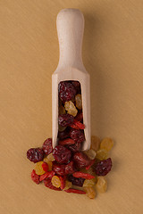 Image showing Wooden scoop with mixed dried fruits