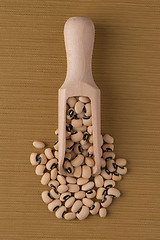 Image showing Wooden scoop with white beans