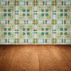 Image showing Wood table top and blur vintage ceramic tile pattern wall