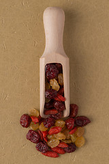 Image showing Wooden scoop with mixed dried fruits