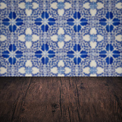 Image showing Wood table top and blur vintage ceramic tile pattern wall