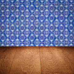 Image showing Wood table top and blur vintage ceramic tile pattern wall