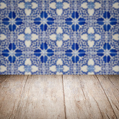 Image showing Wood table top and blur vintage ceramic tile pattern wall