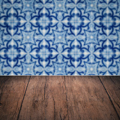 Image showing Wood table top and blur vintage ceramic tile pattern wall