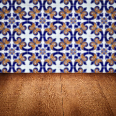 Image showing Wood table top and blur vintage ceramic tile pattern wall