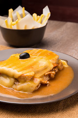 Image showing Francesinha and french fries