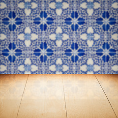 Image showing Wood table top and blur vintage ceramic tile pattern wall