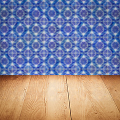 Image showing Wood table top and blur vintage ceramic tile pattern wall