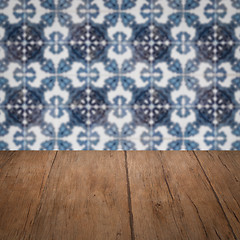 Image showing Wood table top and blur vintage ceramic tile pattern wall