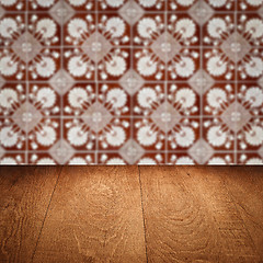 Image showing Wood table top and blur vintage ceramic tile pattern wall