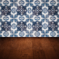 Image showing Wood table top and blur vintage ceramic tile pattern wall