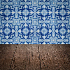 Image showing Wood table top and blur vintage ceramic tile pattern wall