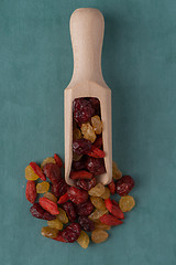 Image showing Wooden scoop with mixed dried fruits